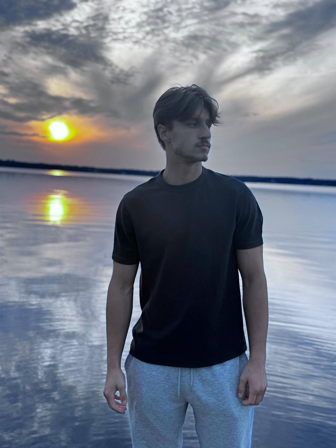 Rinalds Dērics, portrait by a lake at sunset